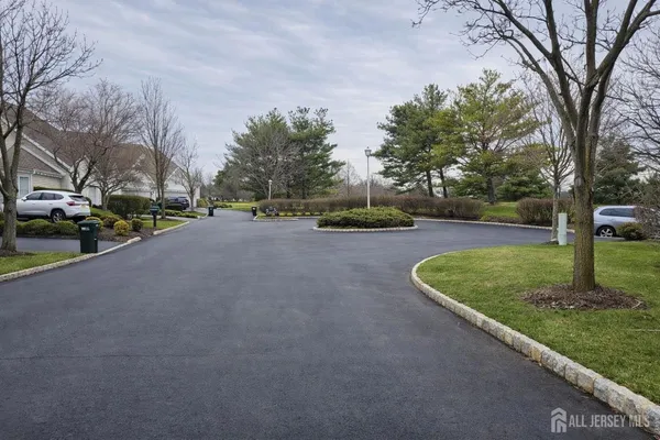 a view of a deck with furniture and trees around