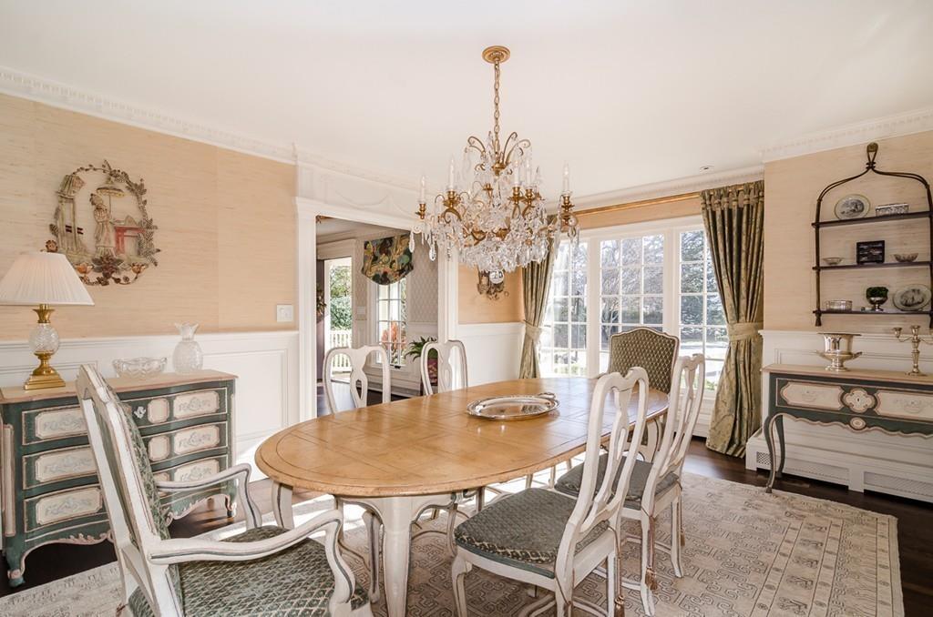 41 Highgate Road Wellesley, MA 02481 - Photo 11 of 24 a dining room with furniture a chandelier and wooden floor