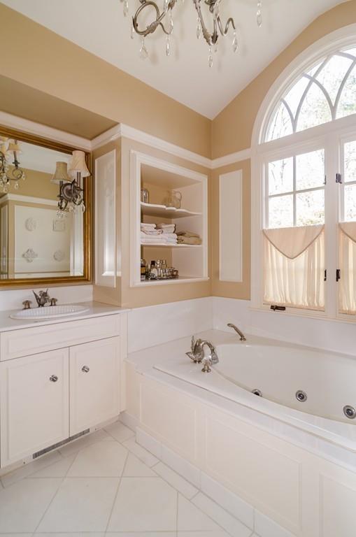 41 Highgate Road Wellesley, MA 02481 - Photo 21 of 24 a bathroom with a tub sink and mirror