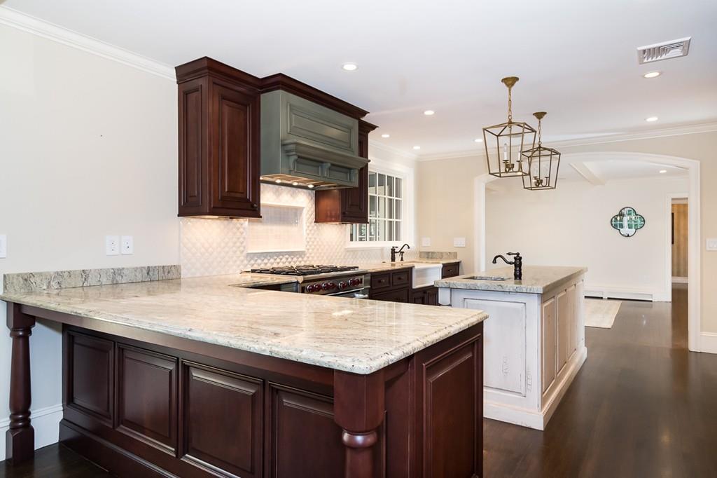 41 Highgate Road Wellesley, MA 02481 - Photo 8 of 24 a kitchen with a sink a stove a microwave and wooden floor