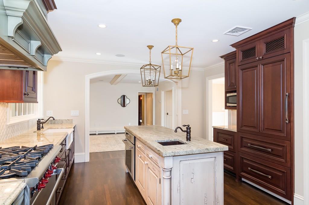 41 Highgate Road Wellesley, MA 02481 - Photo 9 of 24 a kitchen with a sink stove and cabinets