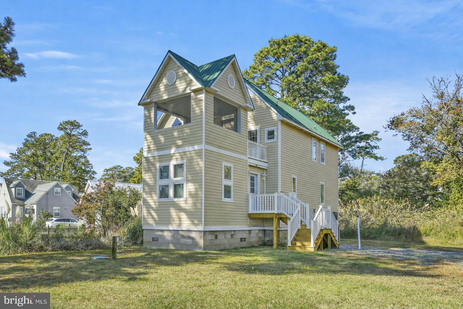 4475 Deep Hole Road Chincoteague Island, VA 23336 - Photo 1 of 1 a front view of a house with a yard