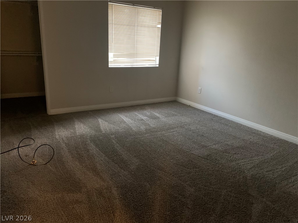 7885 West Flamingo Road, Unit 1003 Las Vegas, NV 89147 - Photo 5 of 7 A spacious chamber awaits personalization, complete with new carpet and a convenient closet.