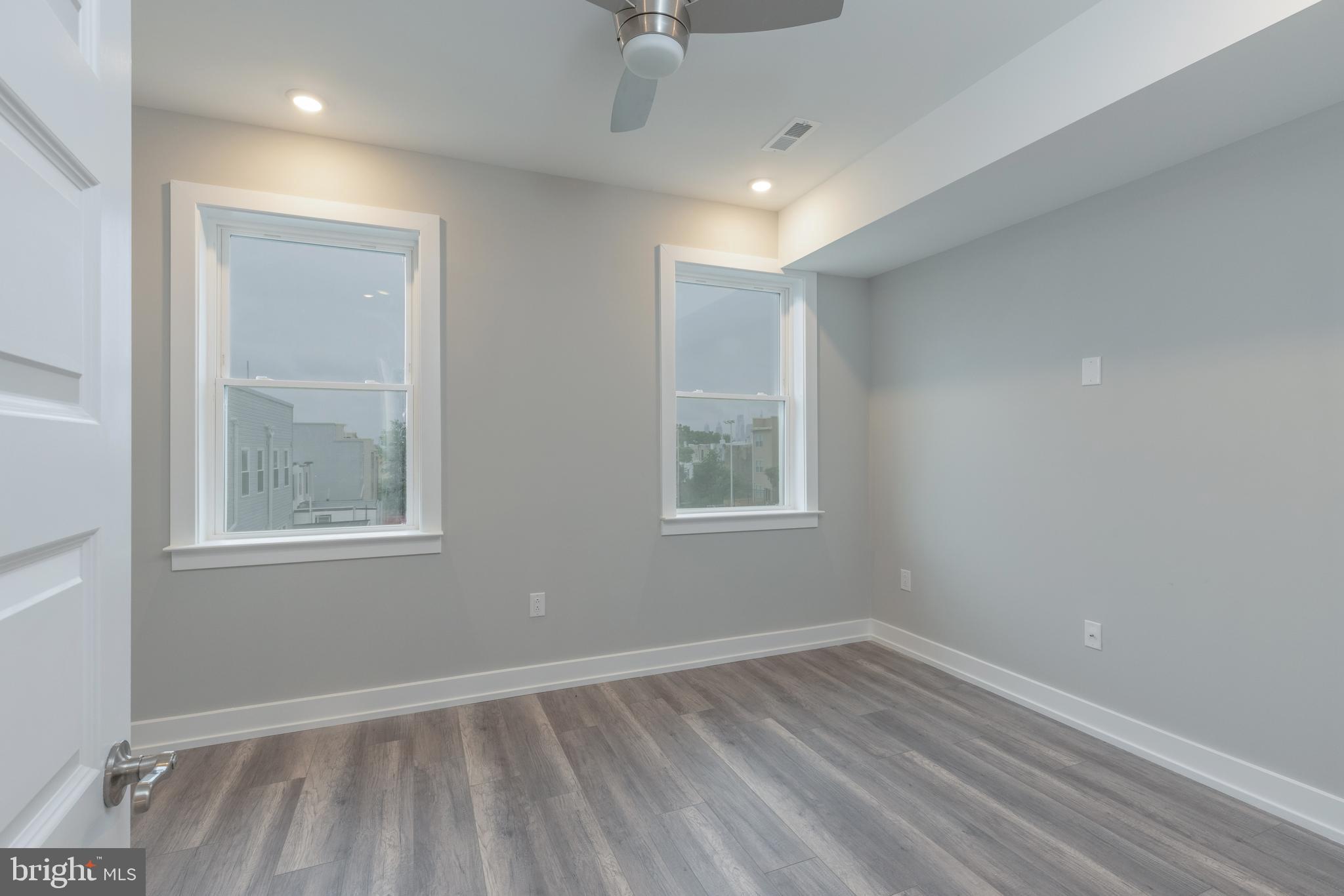 135 West Huntingdon Street, Unit 2 Philadelphia, PA 19133 - Photo 15 of 29 an empty room with windows and closet