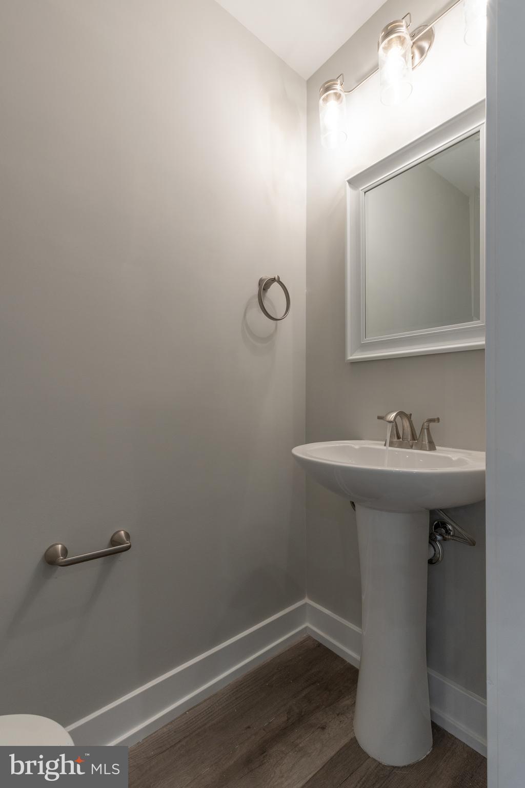 135 West Huntingdon Street, Unit 2 Philadelphia, PA 19133 - Photo 7 of 29 a bathroom with a sink toilet and vanity