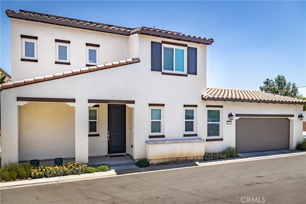 347 Carson Court Rialto, CA 92376 - Photo 1 of 1 a front view of a house with yard
