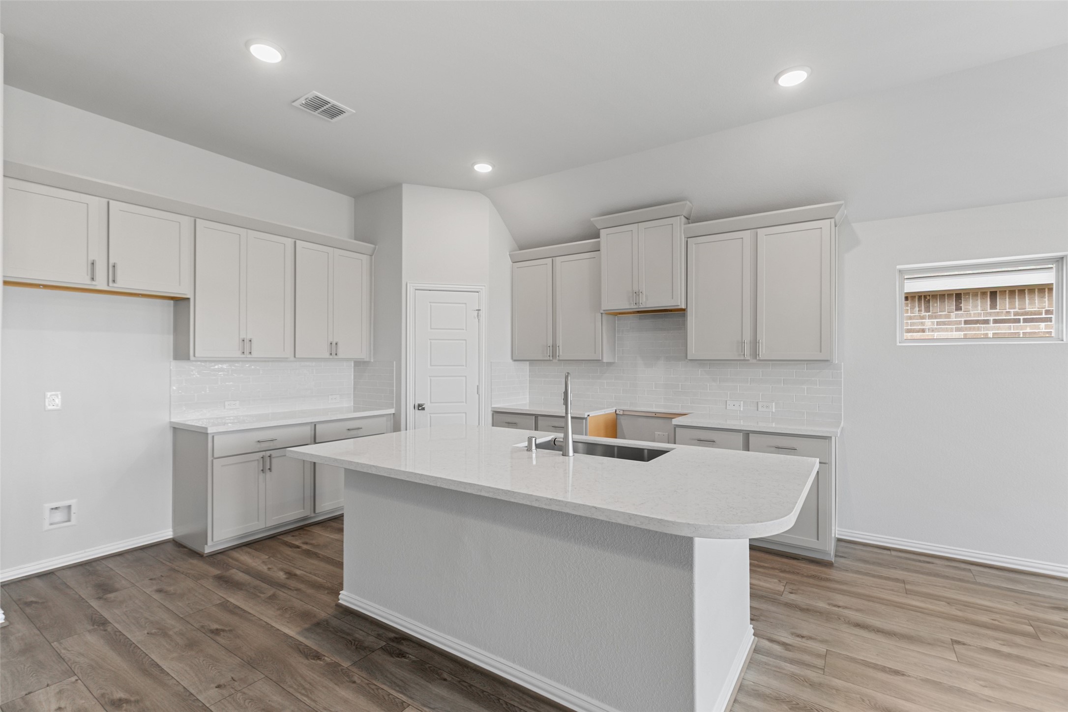 803 Evergreen Frst Lane Rosharon, TX 77583 - Photo 17 of 31 a kitchen with a sink cabinets and wooden floor