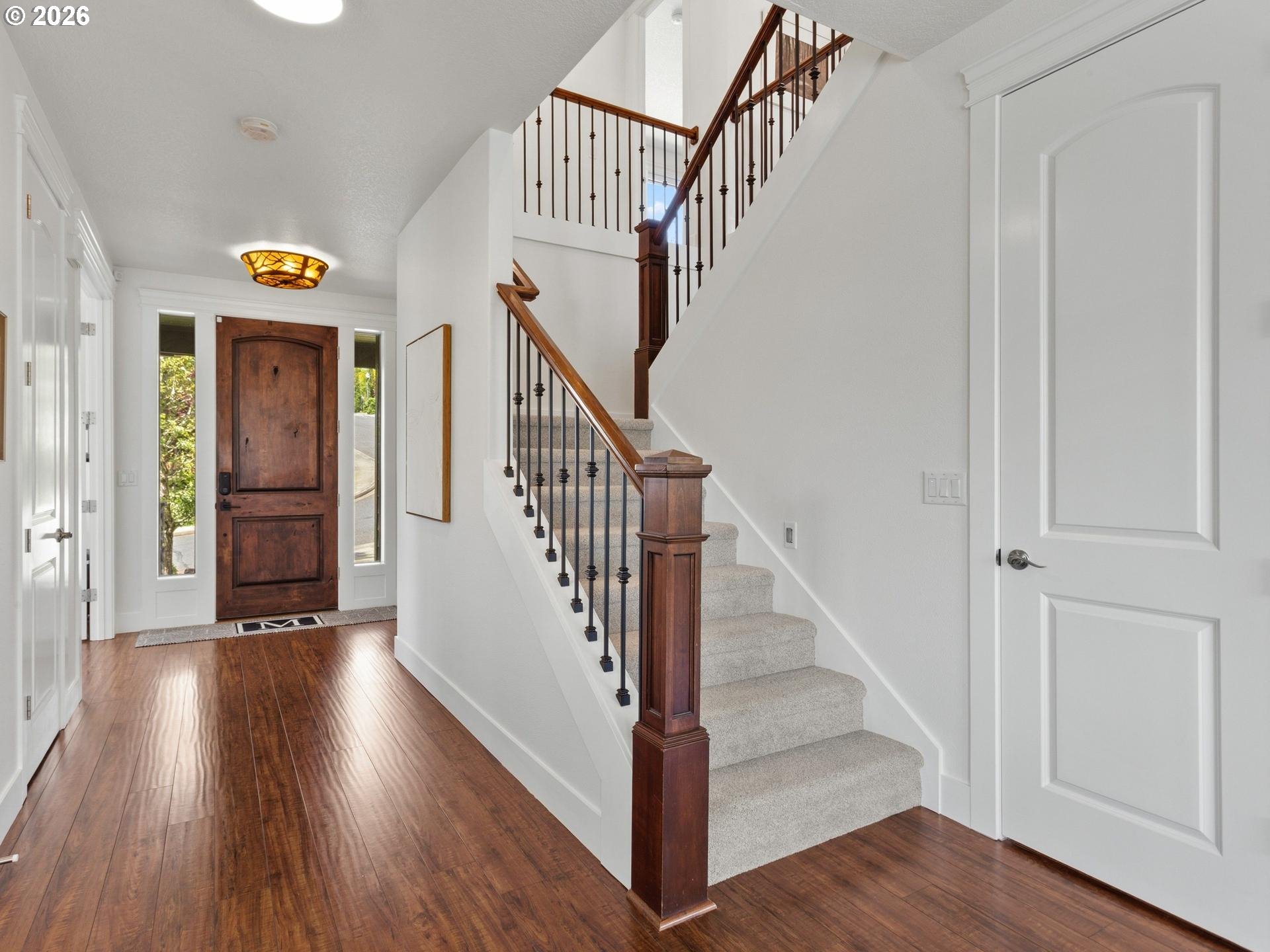 1012 Northwest Goodwin Street Camas, WA 98607 - Photo 16 of 44 a view of staircase with wooden floor and a window