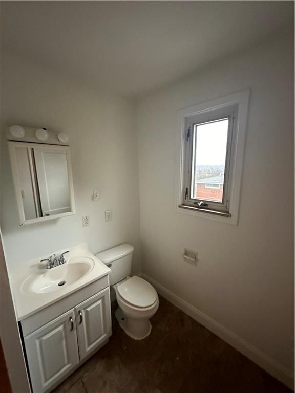 615 Division Street Monessen, PA 15062 - Photo 11 of 15 a bathroom with a toilet sink and mirror