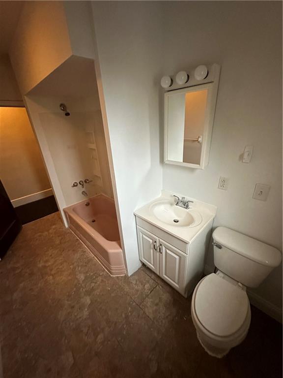 615 Division Street Monessen, PA 15062 - Photo 12 of 15 a bathroom with a toilet a sink and mirror