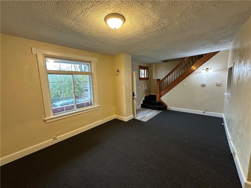 615 Division Street Monessen, PA 15062 - Photo 6 of 15 a view of an empty room with a window