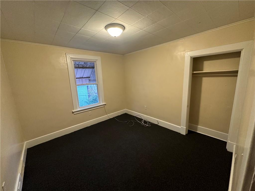 615 Division Street Monessen, PA 15062 - Photo 9 of 15 a view of an empty room with a window