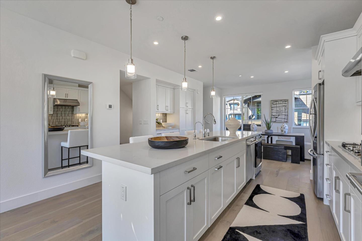 2032 Thea Circle Mountain View, CA 94043 - Photo 5 of 29 a kitchen with white cabinets and sink