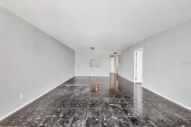 a kitchen with stainless steel appliances granite countertop a refrigerator sink and microwave