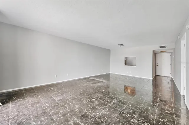 a kitchen with stainless steel appliances a stove a microwave a sink and cabinets