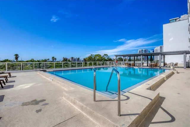 a view of building with front door and outdoor view