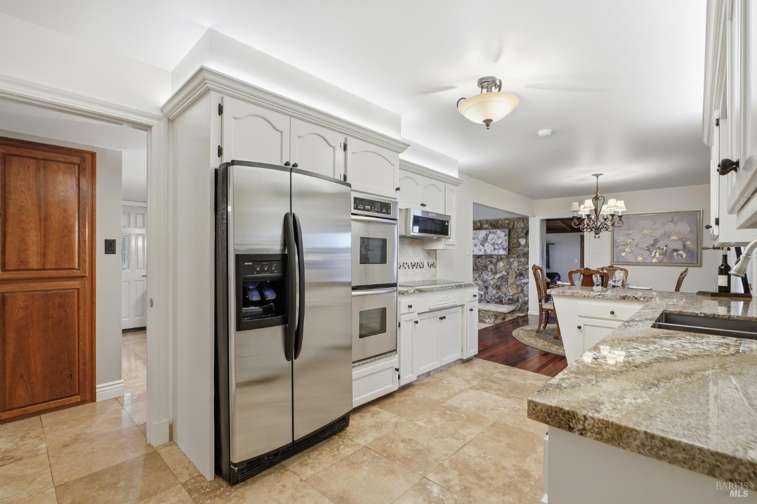 373 Piezzi Road Santa Rosa, CA 95401 - Photo 15 of 55 a kitchen with refrigerator and cabinets