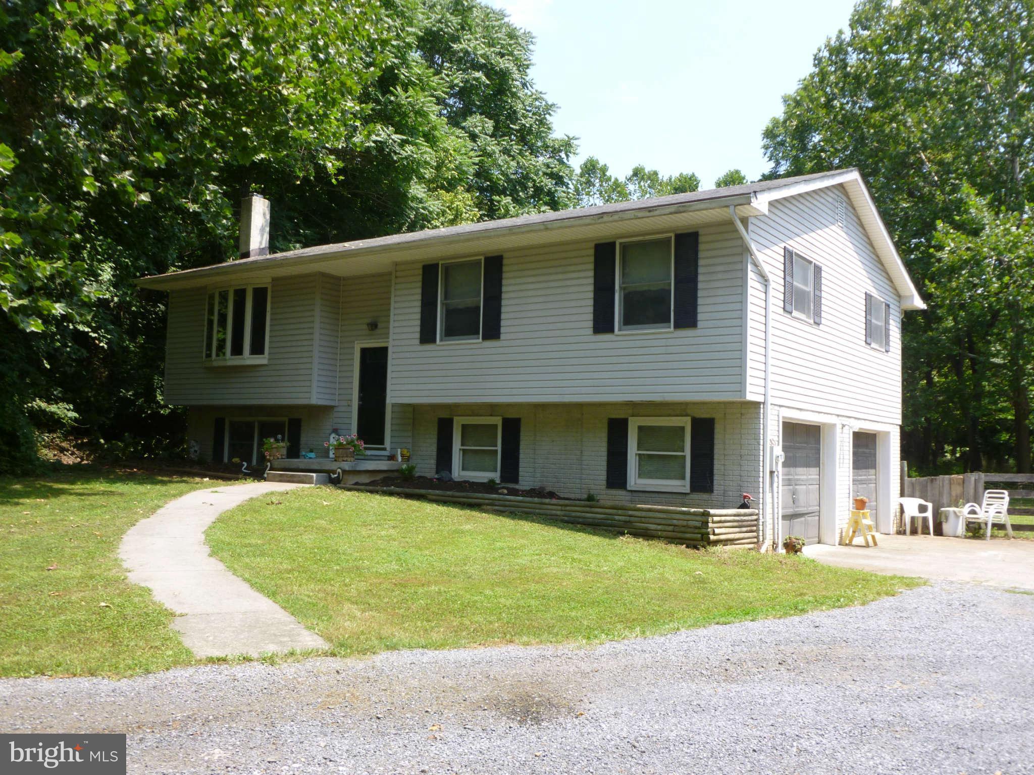 5762 Howellsville Road Front Royal, VA 22630 - Photo 1 of 22 a front view of house with yard and green space