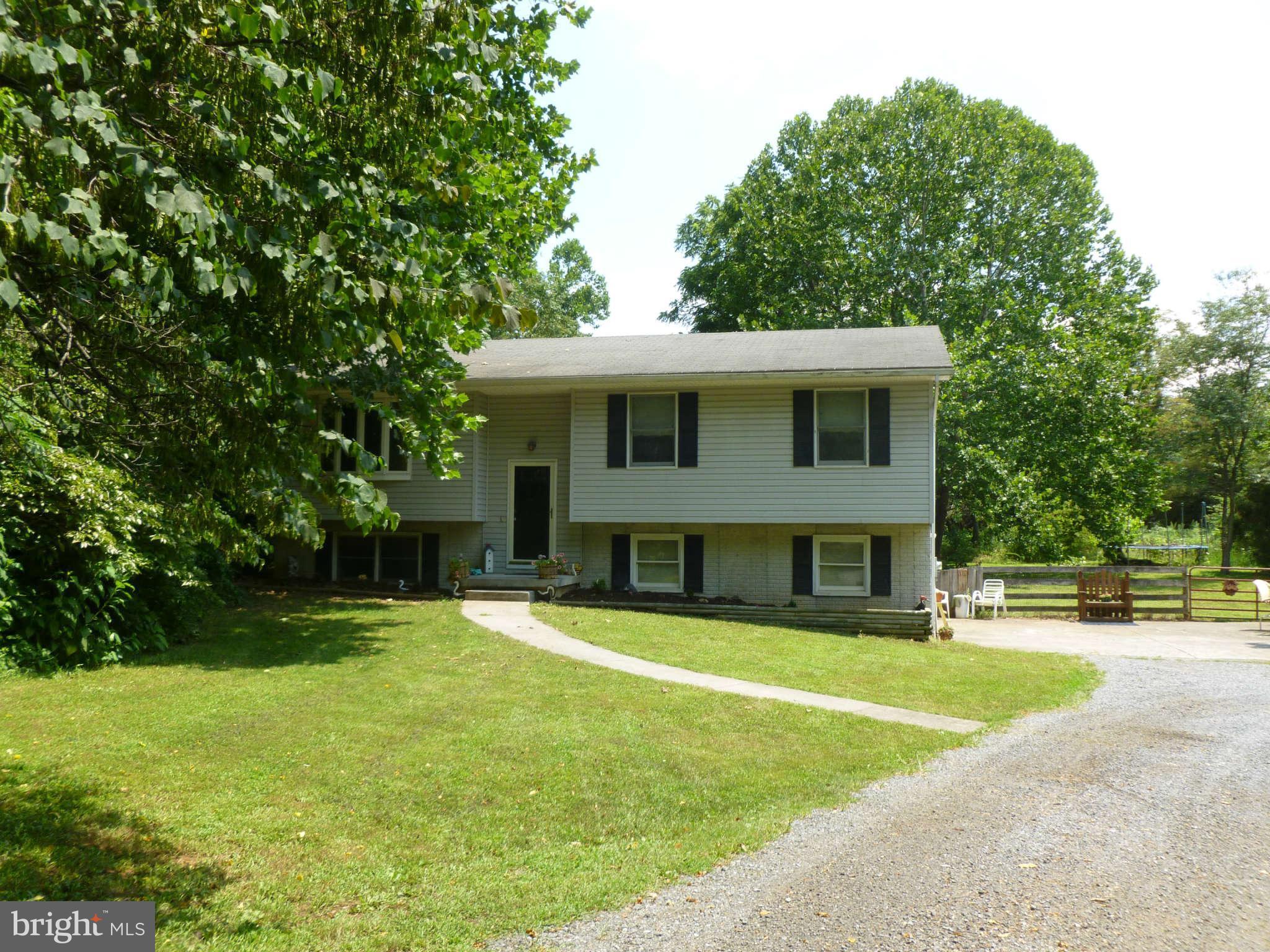 5762 Howellsville Road Front Royal, VA 22630 - Photo 2 of 22 a front view of a house with a yard