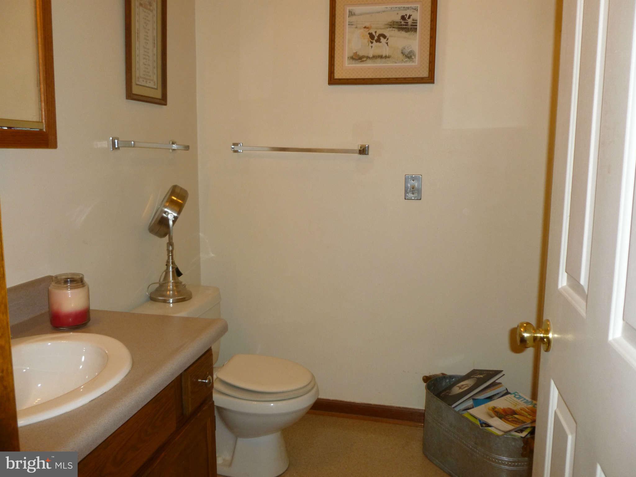 5762 Howellsville Road Front Royal, VA 22630 - Photo 14 of 22 a bathroom with a sink toilet and vanity