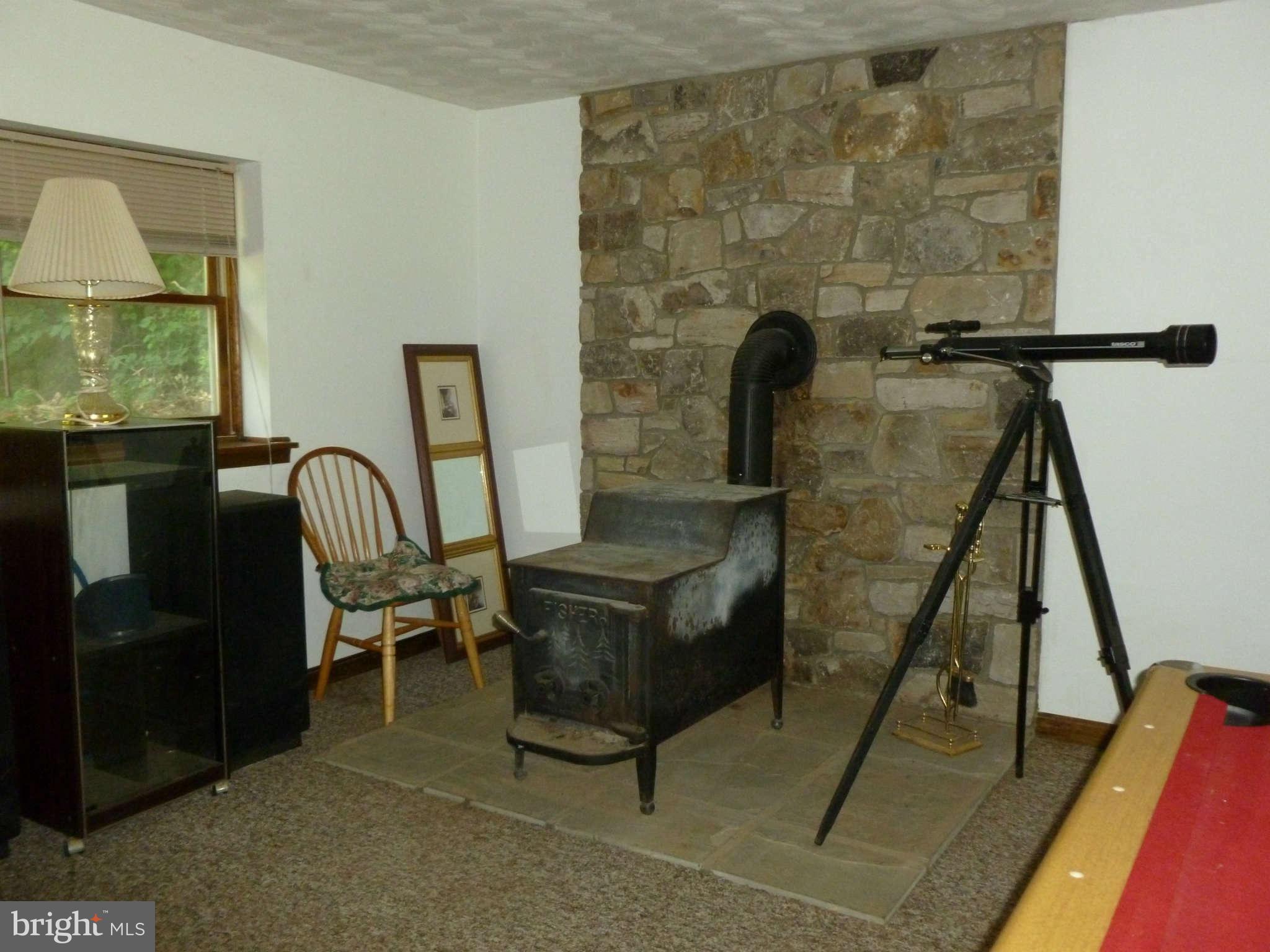 5762 Howellsville Road Front Royal, VA 22630 - Photo 20 of 22 a living room with a couch and a table