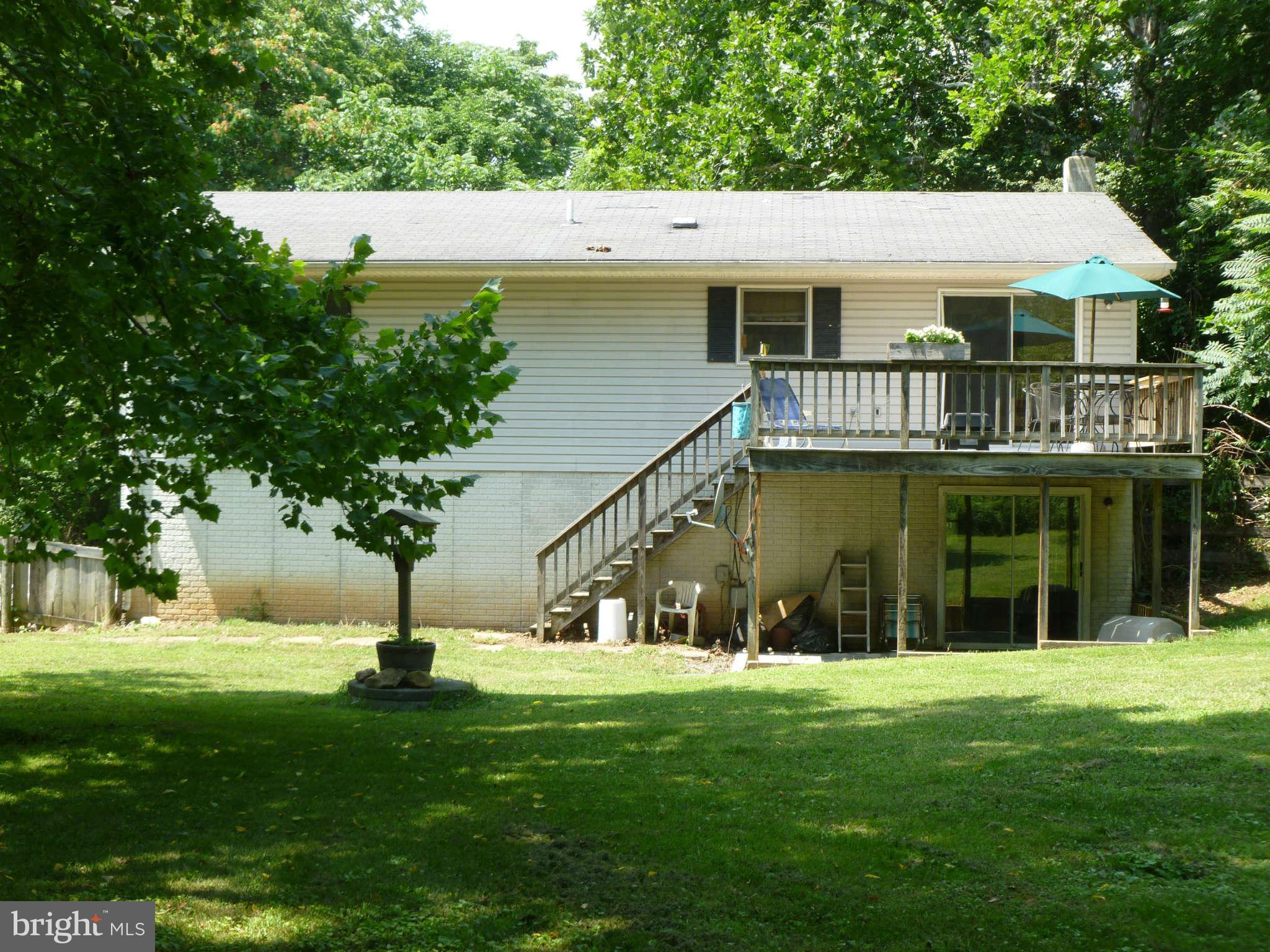 5762 Howellsville Road Front Royal, VA 22630 - Photo 6 of 22 a view of a house with a yard
