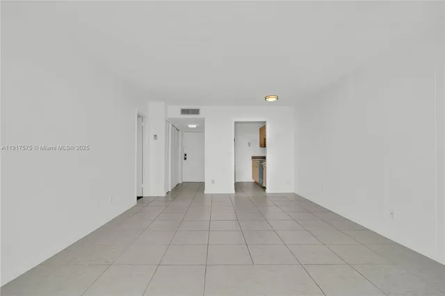 an empty room with a bathroom