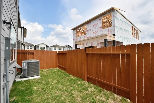 a view of a street with potted plants and roof