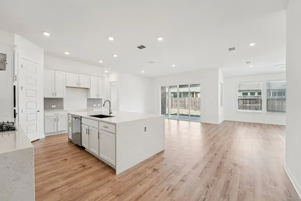 a view of a livingroom with a ceiling fan and window