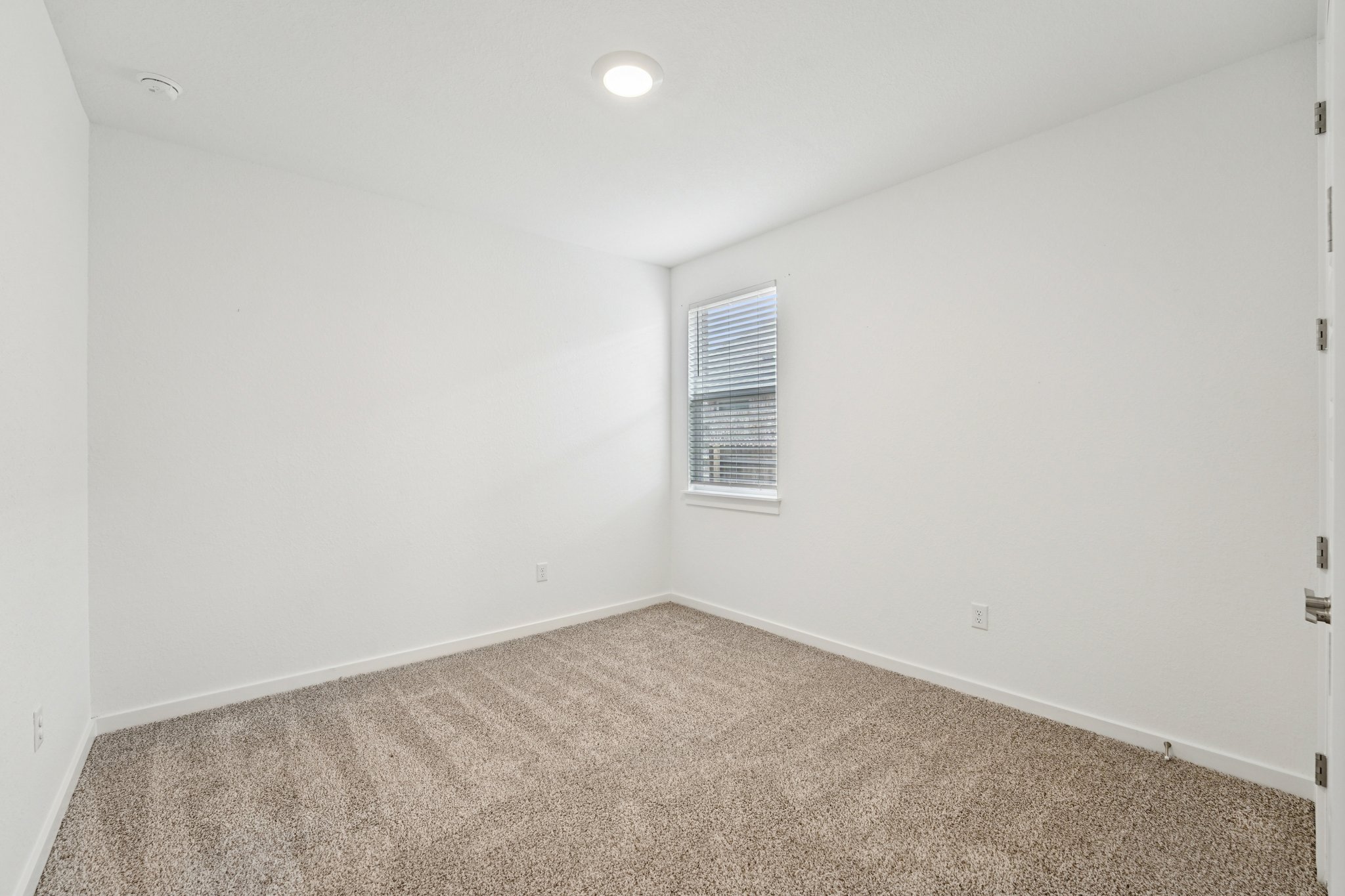 2233 Bravo Pass Leander, TX 78641 - Photo 13 of 33 Spare room with carpet floors and baseboards