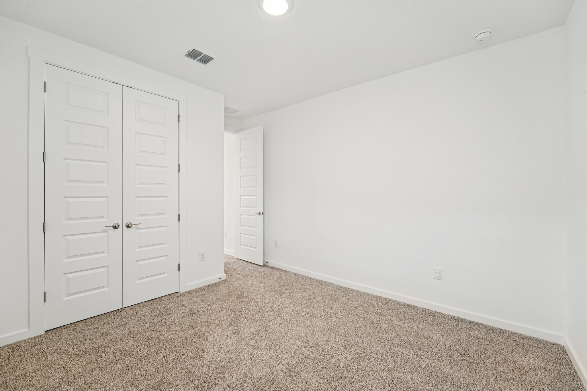 2233 Bravo Pass Leander, TX 78641 - Photo 14 of 33 Unfurnished bedroom featuring carpet flooring and a closet
