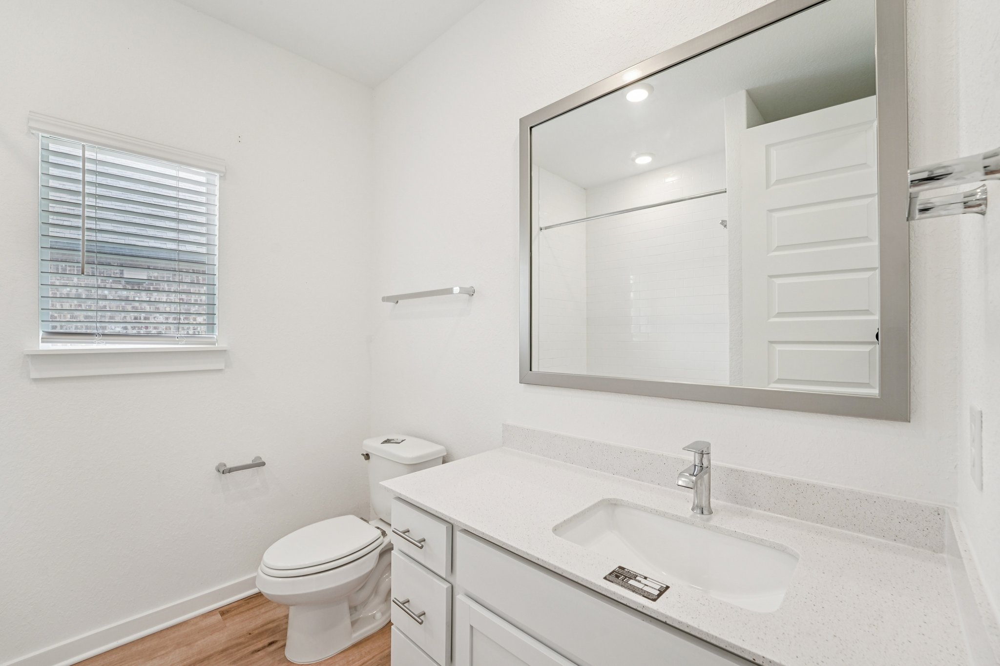 2233 Bravo Pass Leander, TX 78641 - Photo 15 of 33 Full bathroom featuring light wood-type flooring, vanity, a shower, and recessed lighting