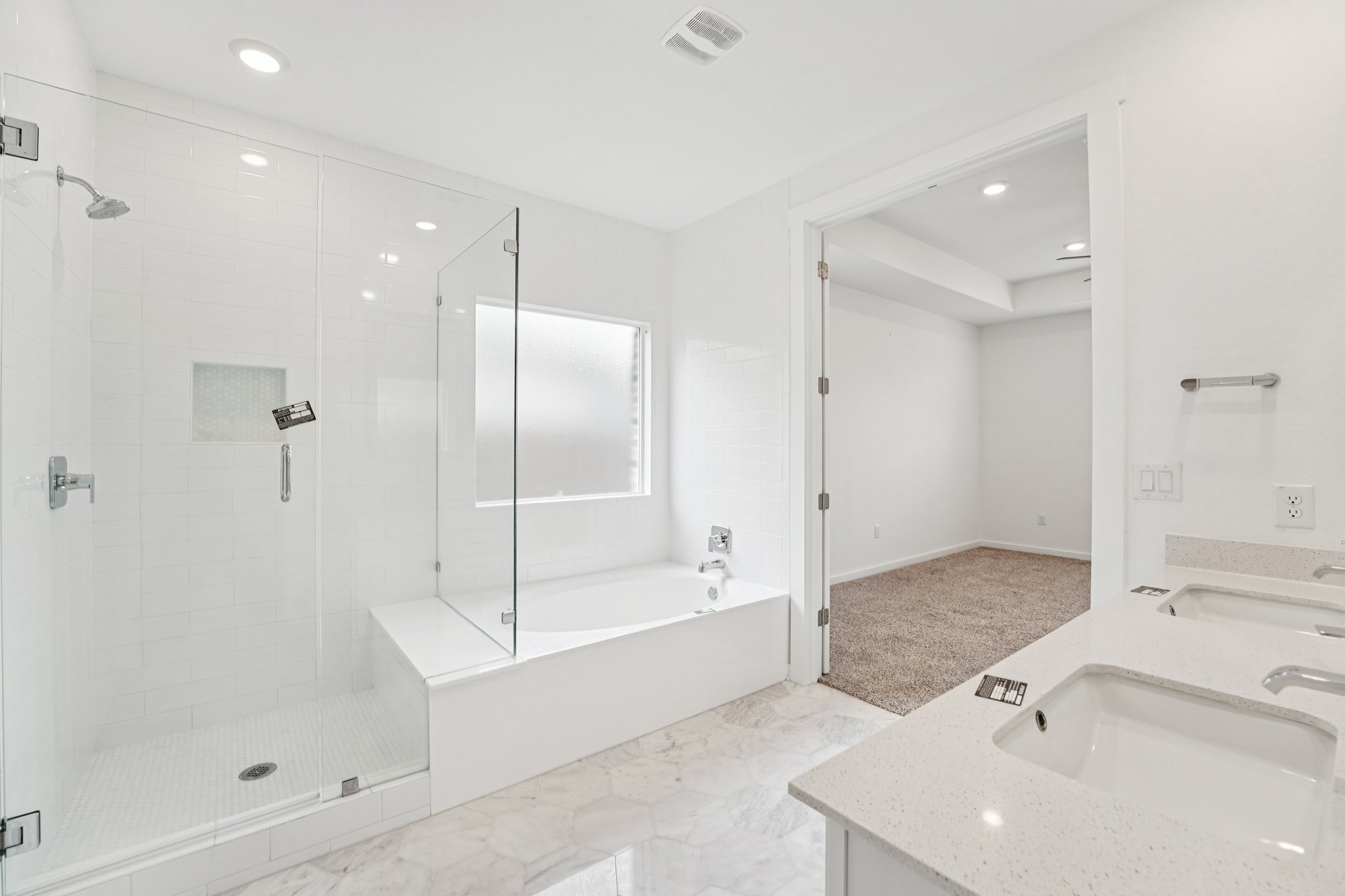 2233 Bravo Pass Leander, TX 78641 - Photo 18 of 33 Full bathroom featuring double vanity, a stall shower, a bath, and recessed lighting