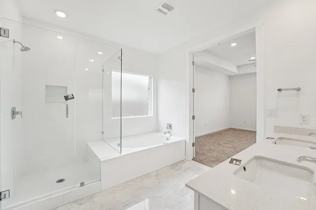 a bathroom with a sink toilet and vanity