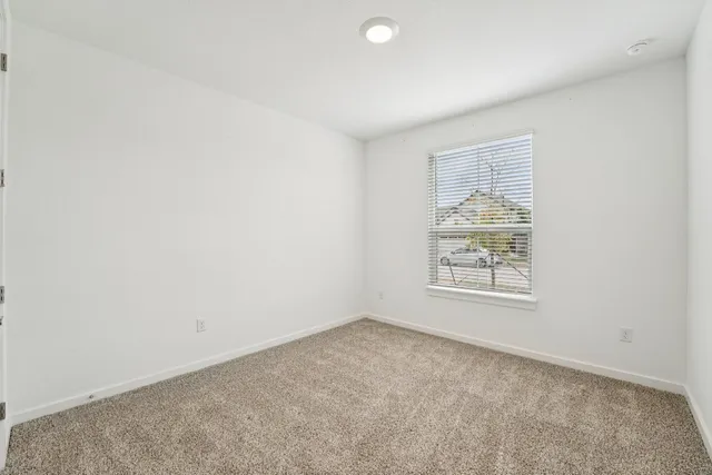 a bathroom with a tub shower and sink