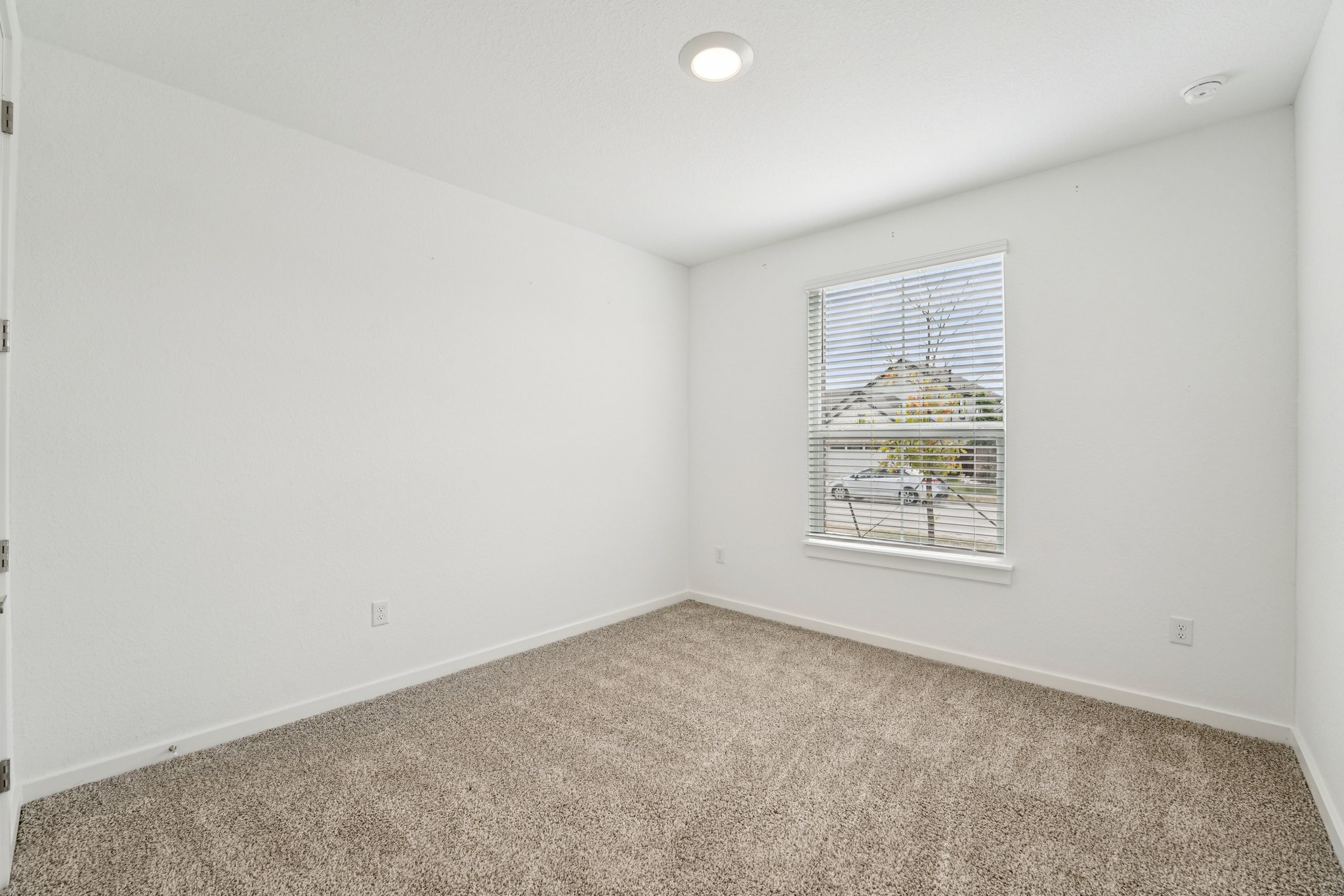 2233 Bravo Pass Leander, TX 78641 - Photo 21 of 33 Carpeted empty room featuring baseboards