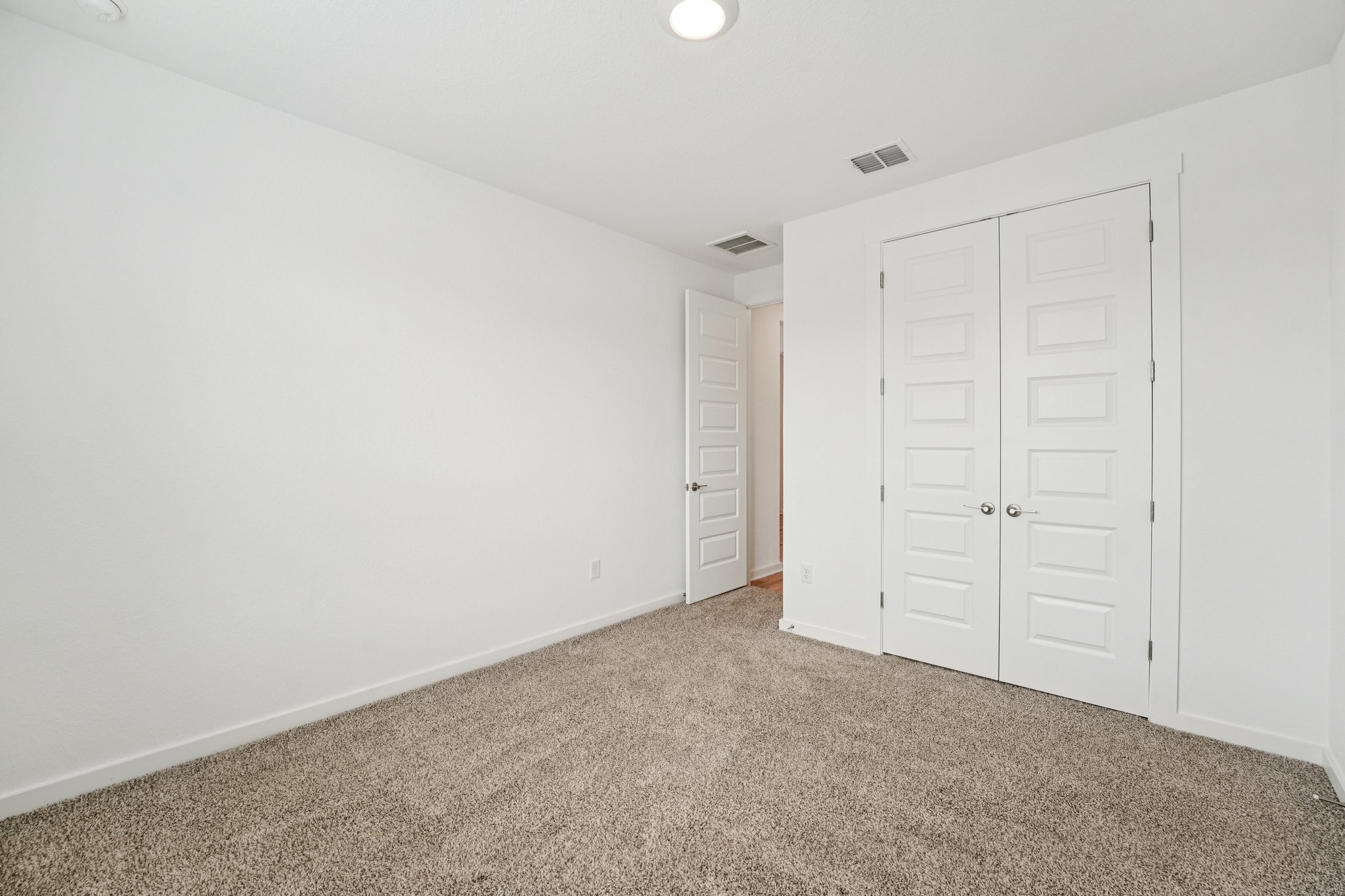 2233 Bravo Pass Leander, TX 78641 - Photo 22 of 33 Unfurnished bedroom featuring carpet floors, a closet, and recessed lighting