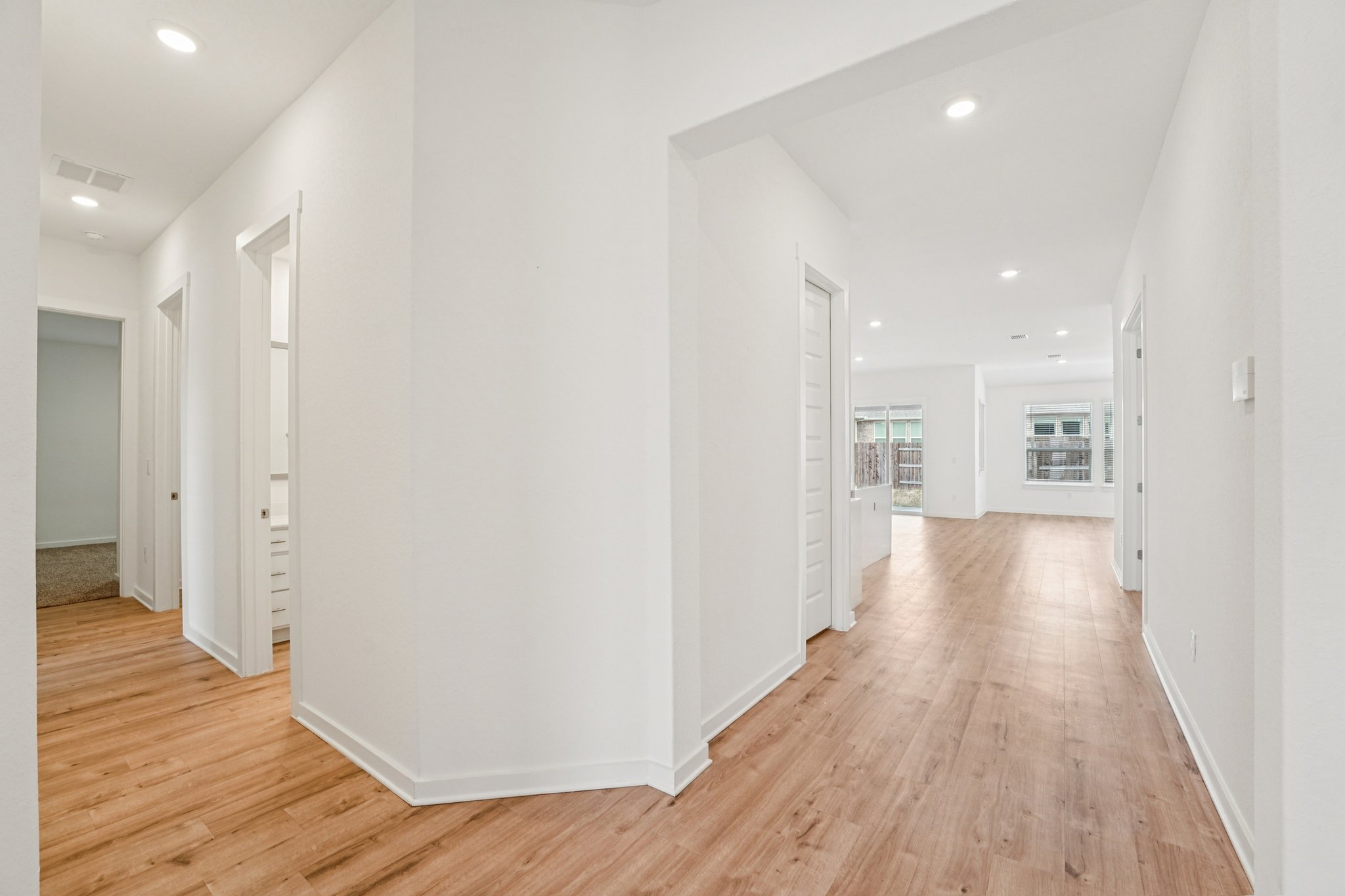 2233 Bravo Pass Leander, TX 78641 - Photo 23 of 33 Hall featuring recessed lighting and light wood-type flooring