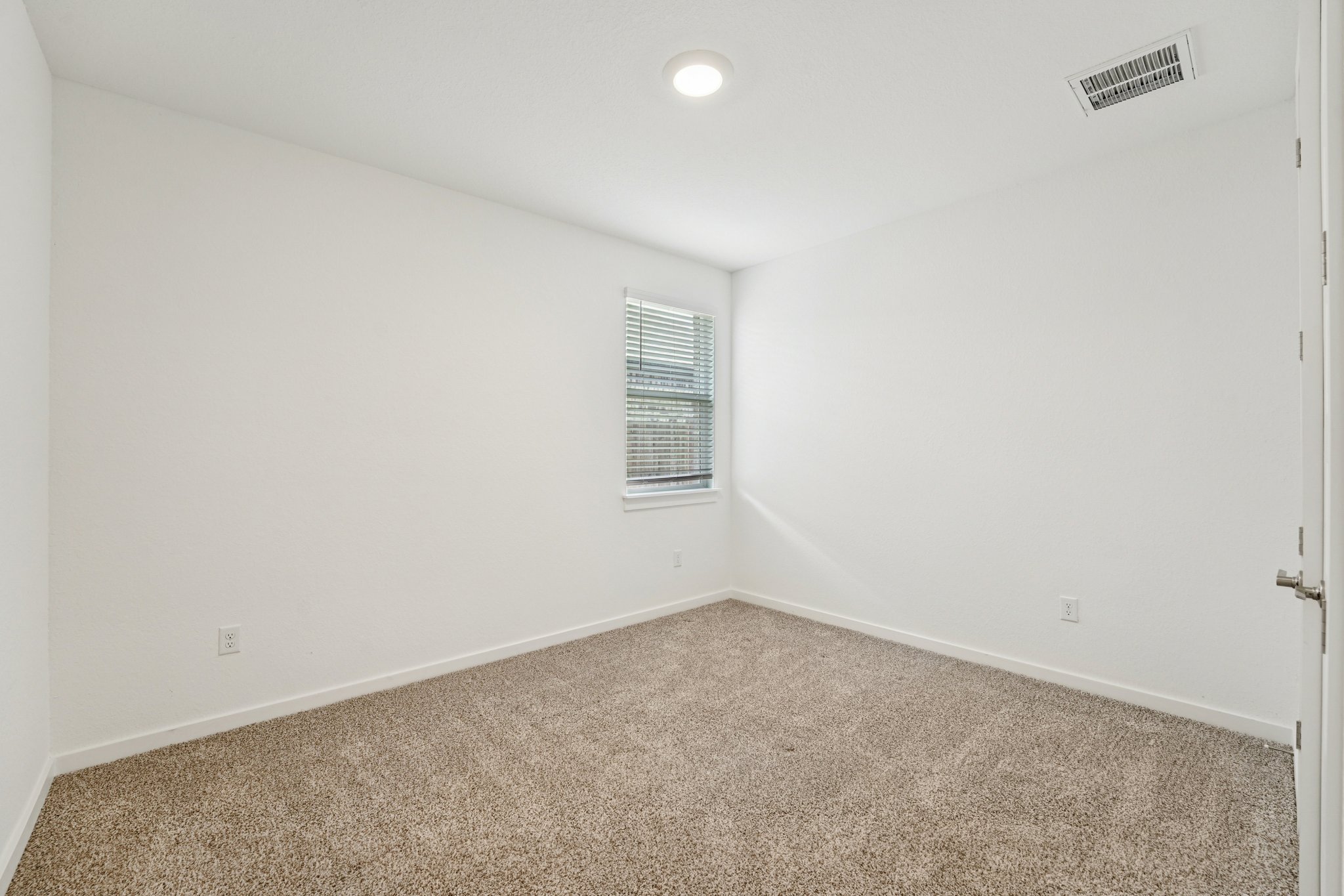 2233 Bravo Pass Leander, TX 78641 - Photo 26 of 33 Carpeted empty room featuring baseboards