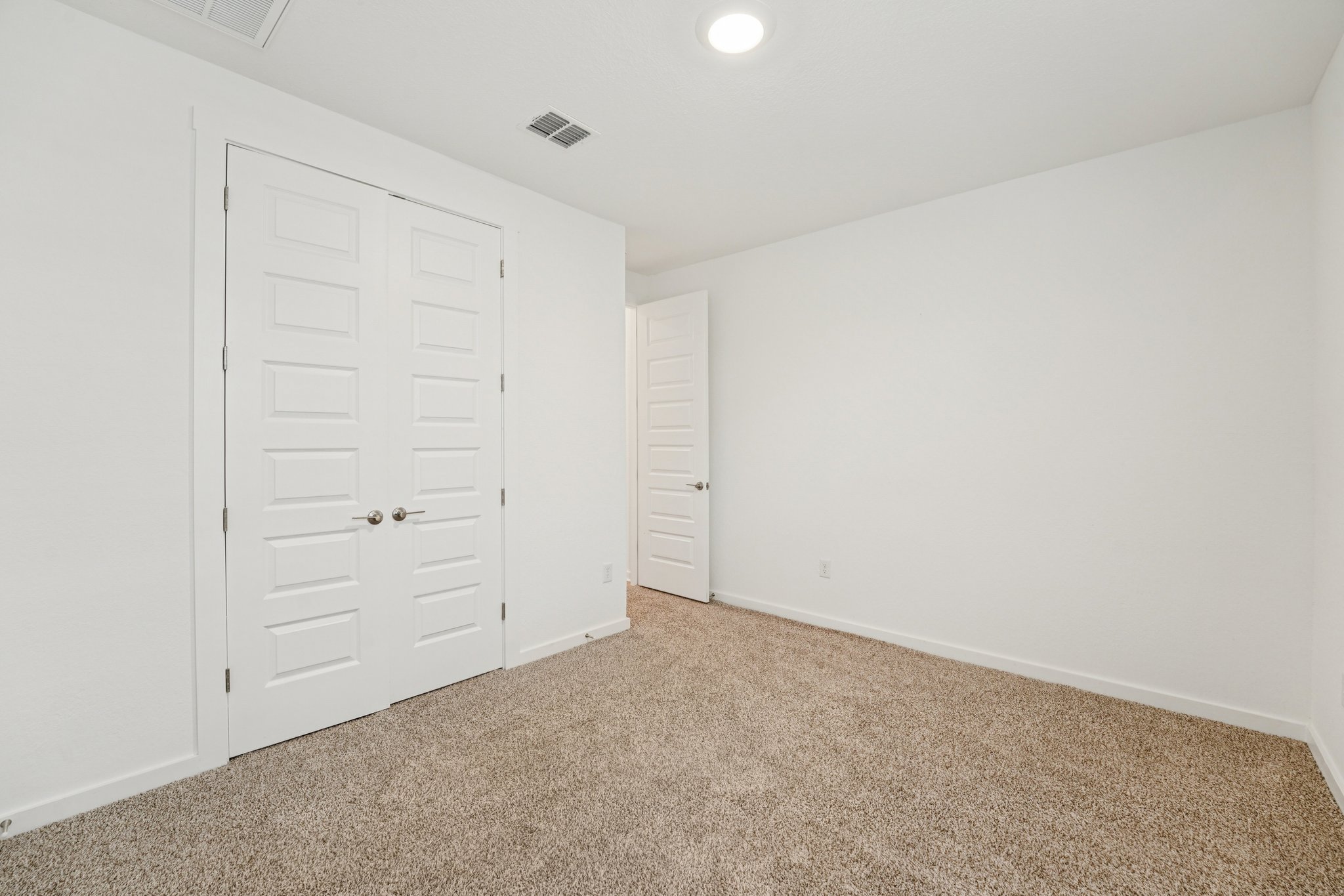 2233 Bravo Pass Leander, TX 78641 - Photo 27 of 33 Unfurnished bedroom featuring carpet and a closet