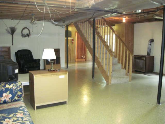 141 Sullivan Road Dickson, TN 37055 - Photo 7 of 12 Spacious basement has wood burning stove that would come in handy during a rough winter- no electricity needed to run this alternate heat source!