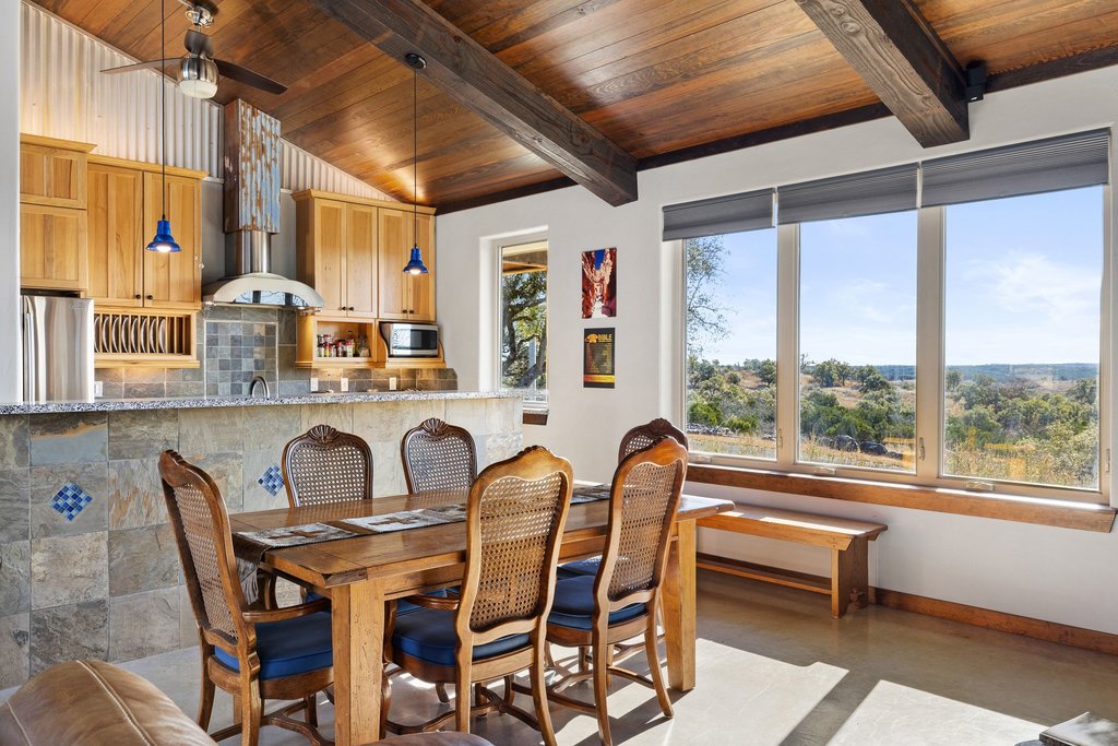 1292 Upper Turtle Creek Road Kerrville, TX 78028 - Photo 6 of 40 Dining area with wood ceiling and baseboards