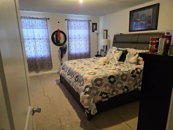 a bedroom with bed and a window