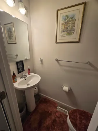 a bathroom with a sink and toilet