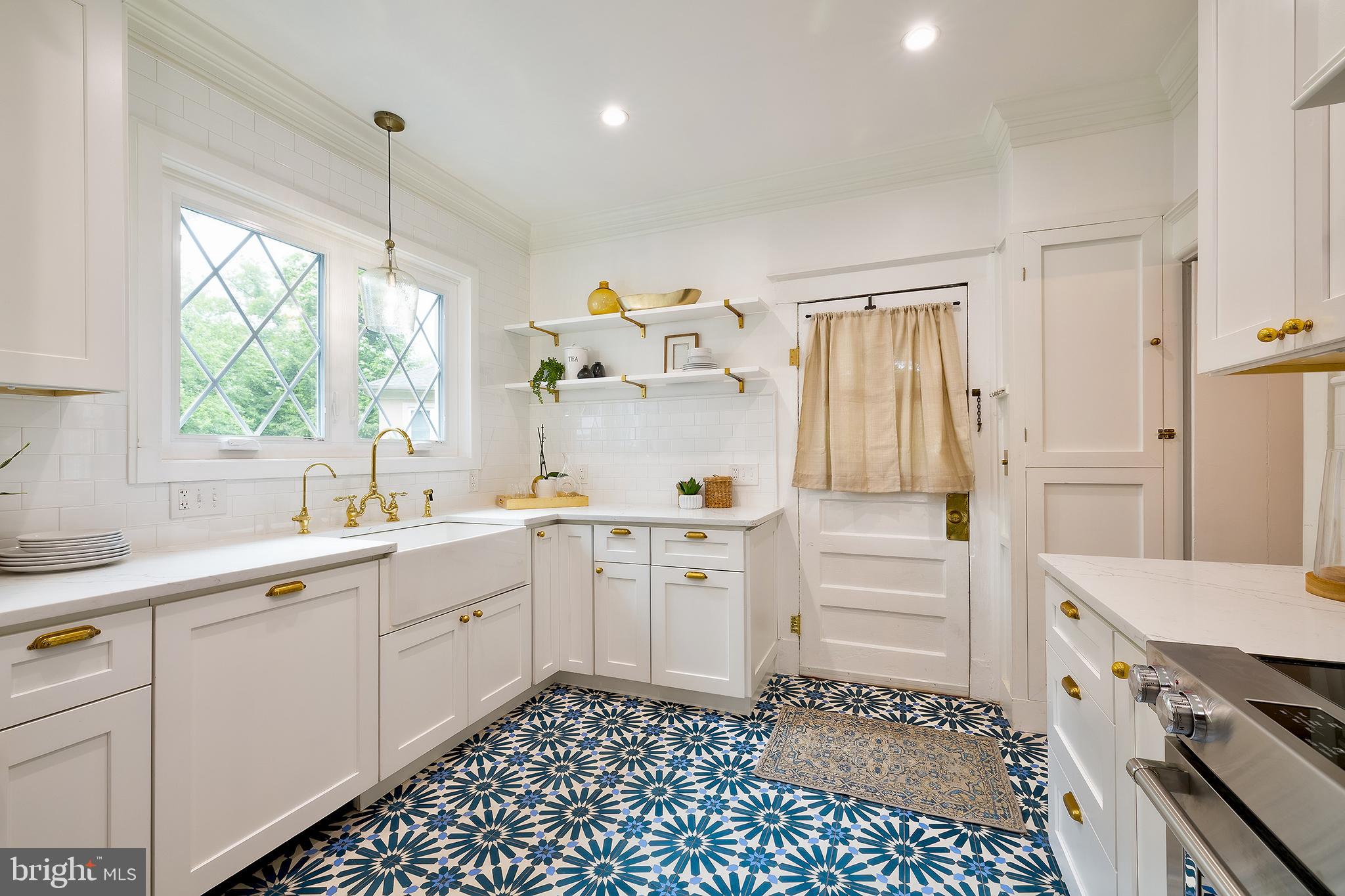 2925 Covington Road Silver Spring, MD 20910 - Photo 15 of 70 a kitchen with a sink cabinets and window