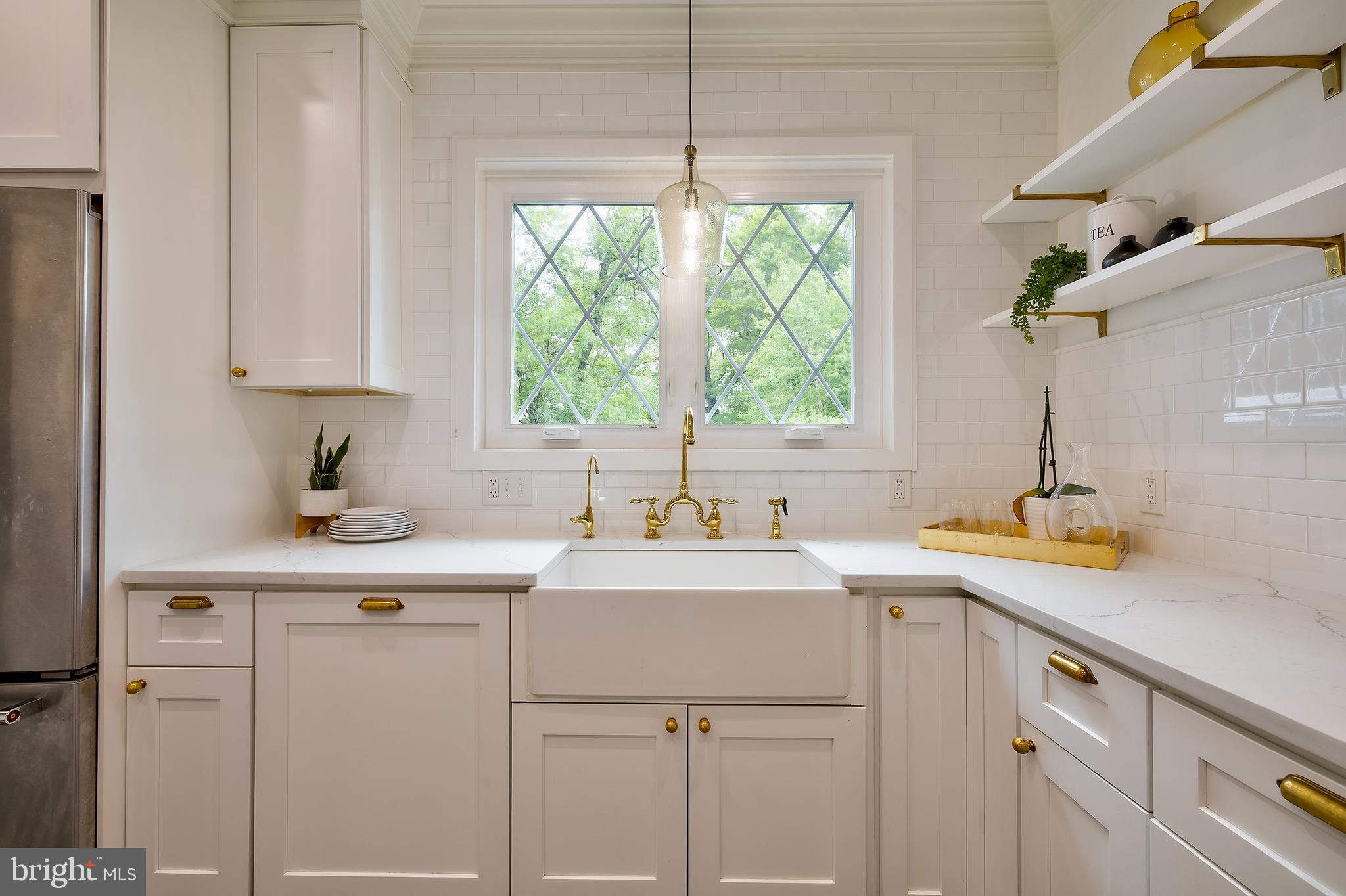 2925 Covington Road Silver Spring, MD 20910 - Photo 17 of 70 a kitchen with a sink cabinets and window