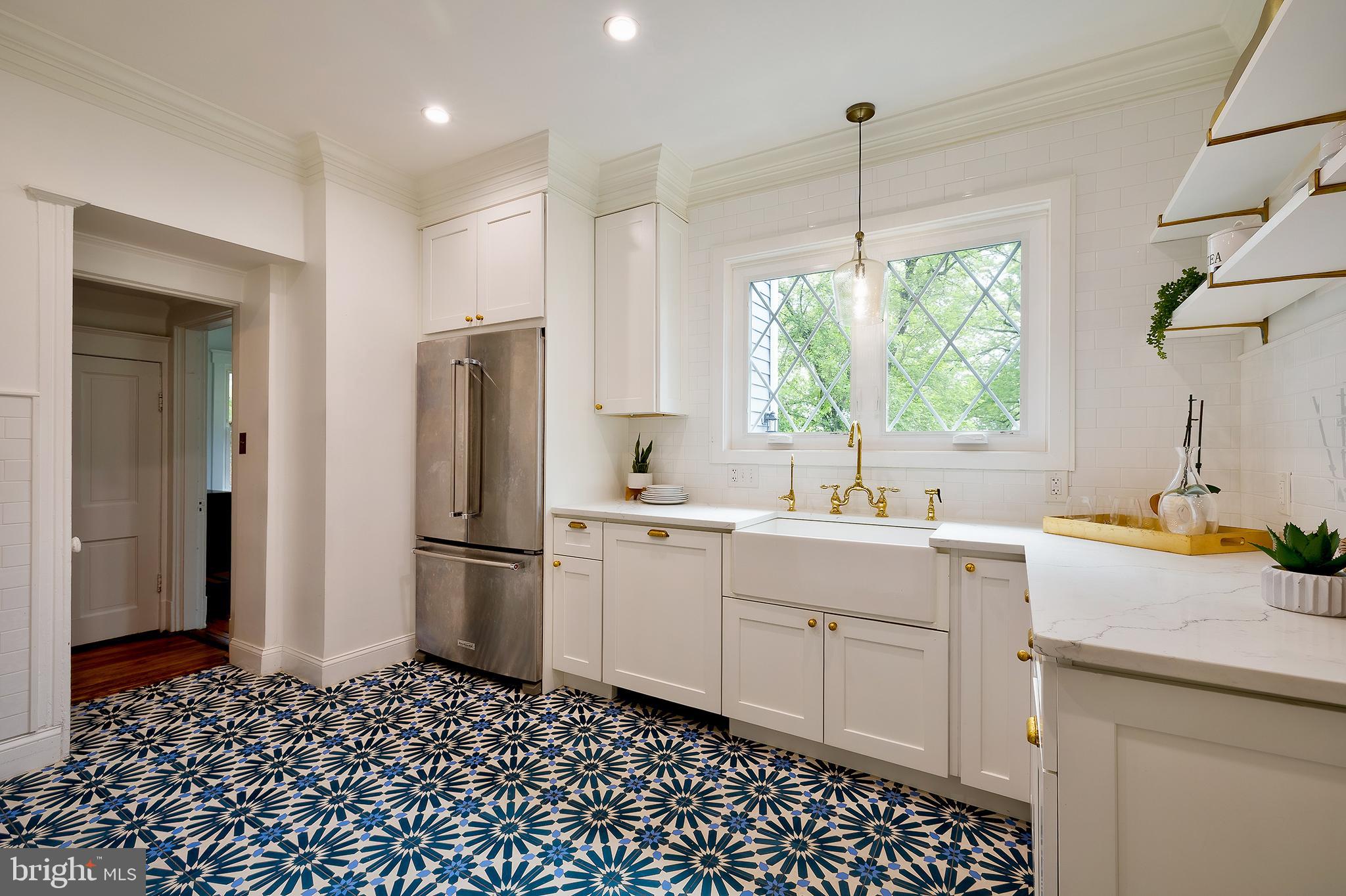 2925 Covington Road Silver Spring, MD 20910 - Photo 18 of 70 a kitchen with a sink window and refrigerator