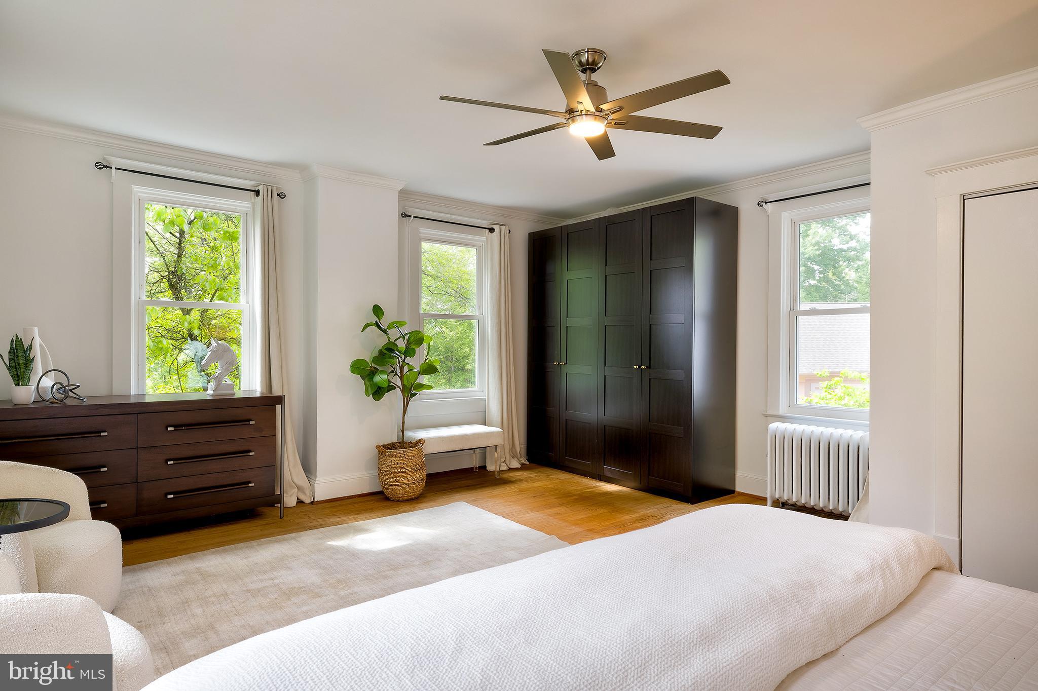 2925 Covington Road Silver Spring, MD 20910 - Photo 35 of 70 a bedroom with a bed and a potted plant