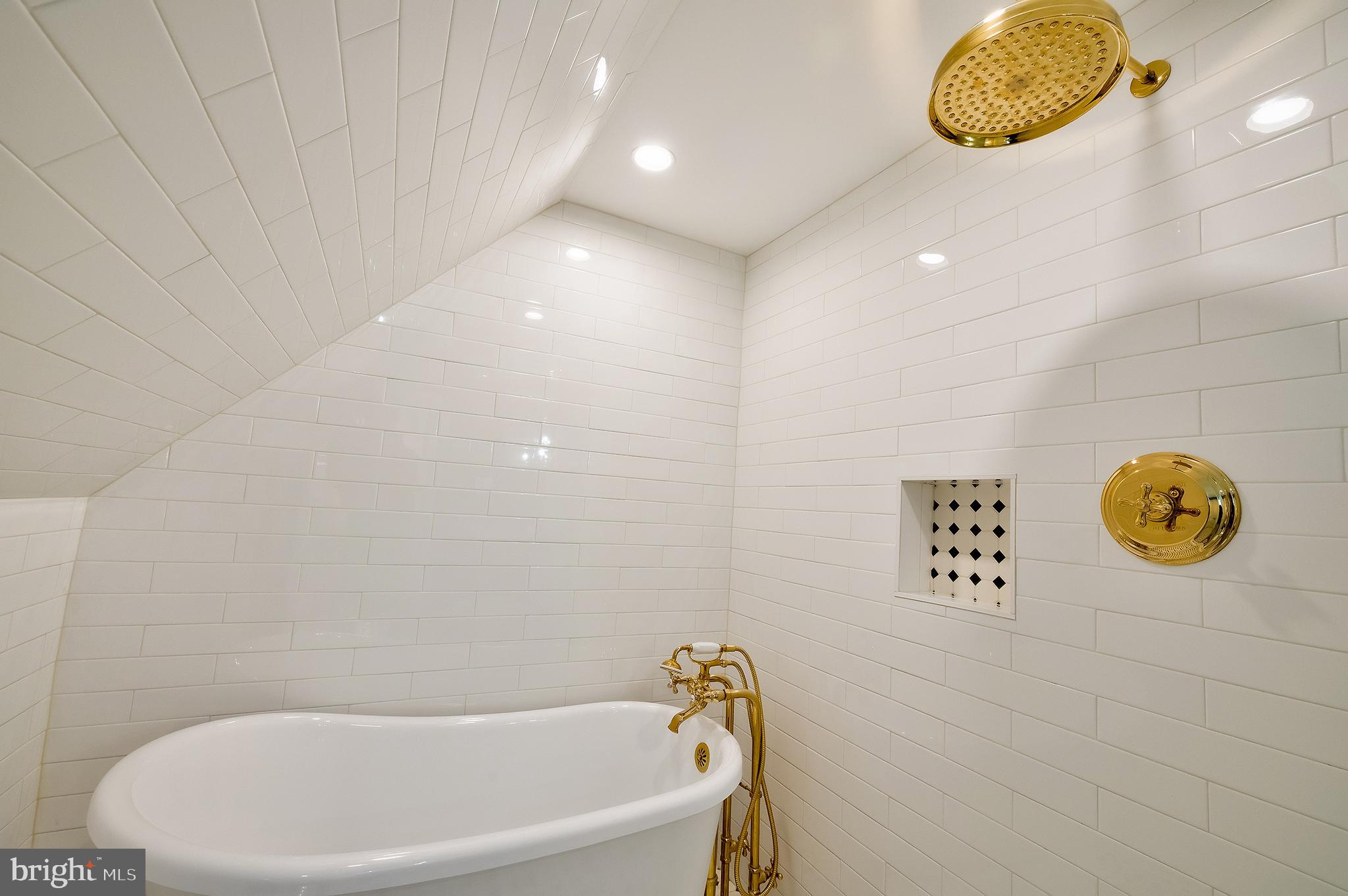 2925 Covington Road Silver Spring, MD 20910 - Photo 38 of 70 a bathroom with a tub and a window