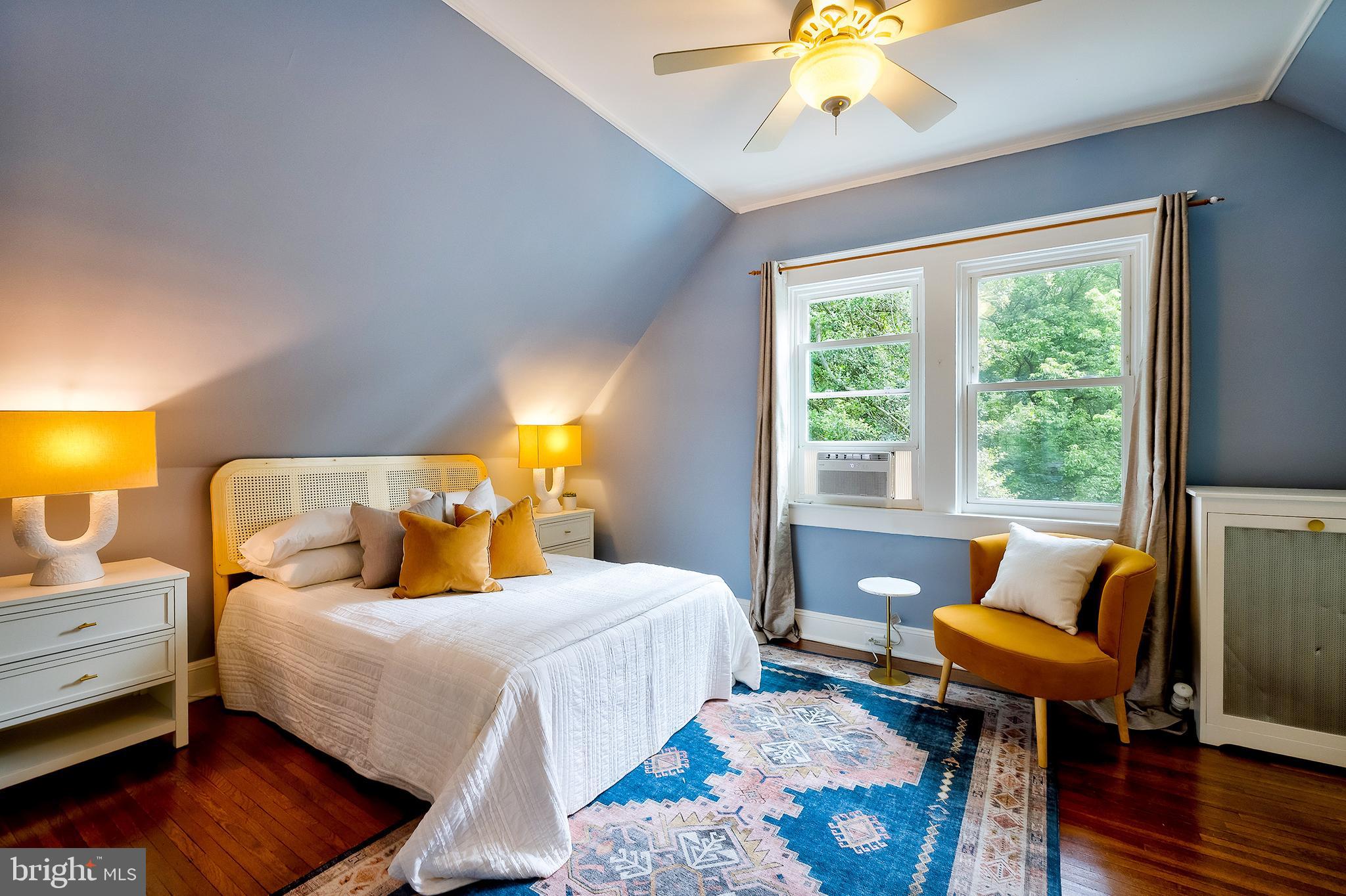 2925 Covington Road Silver Spring, MD 20910 - Photo 40 of 70 a bedroom with a bed and wooden floor
